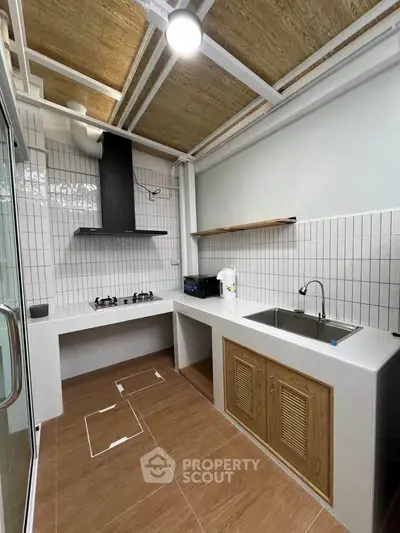 Modern kitchen with gas stove and sleek design