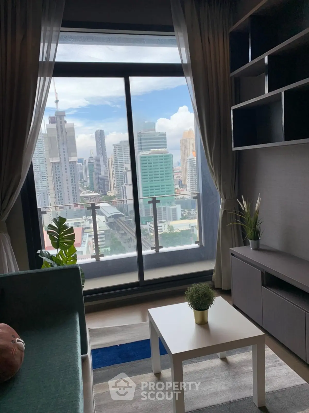 Modern living room with stunning city view and stylish decor