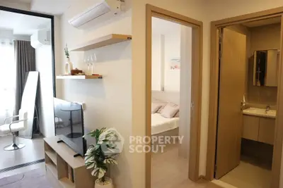 Modern apartment interior with living room, bedroom, and bathroom showcasing stylish decor and natural light.