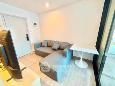 Modern living room with sleek gray sofa and stylish table, perfect for cozy gatherings.
