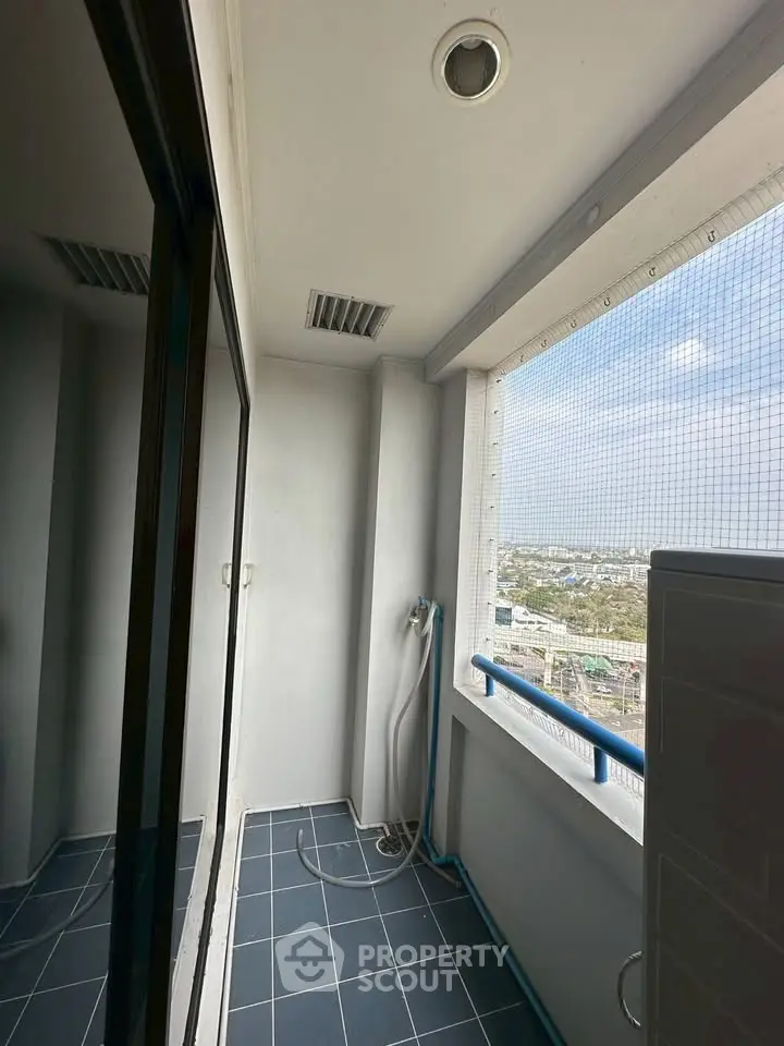 Spacious balcony with city view, perfect for relaxation and enjoying the skyline.