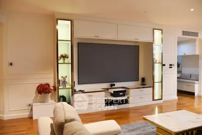 Luxurious living room with modern entertainment center and elegant decor