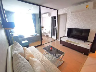 Modern living room with glass partition and stylish decor