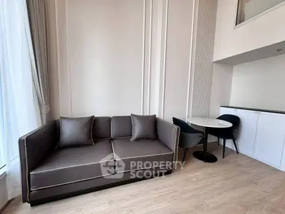 Modern living room with sleek sofa and dining area in stylish apartment