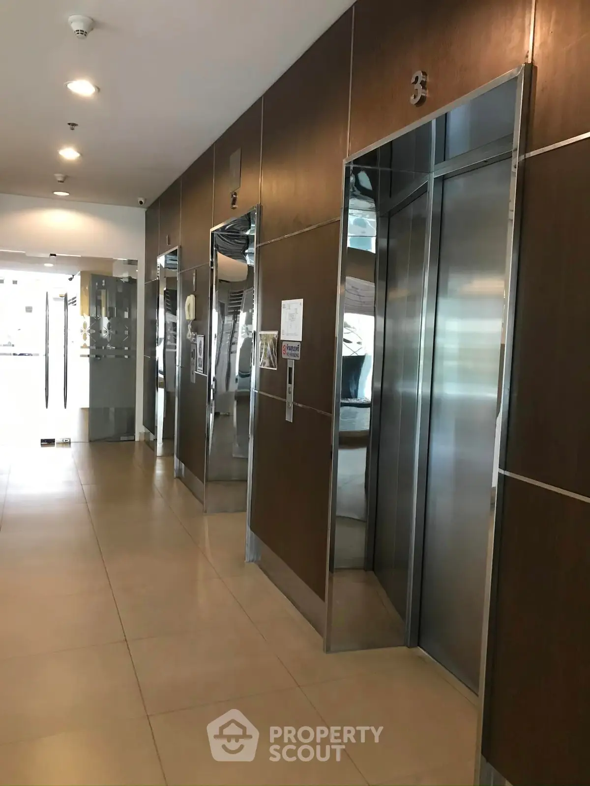 Modern building elevator lobby with sleek design and polished finishes