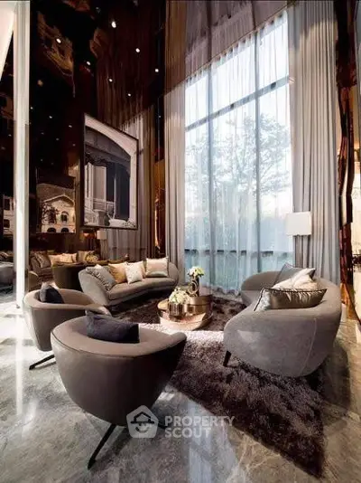Luxurious living room with high ceilings and elegant decor