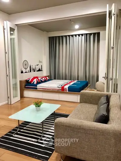 Modern studio apartment with stylish decor and cozy living area.