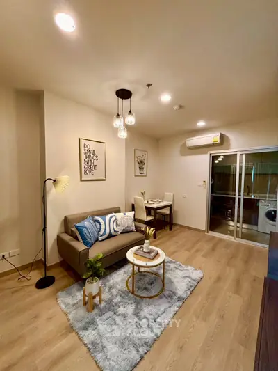 Modern living room with cozy decor and stylish furniture, perfect for relaxation and entertaining.