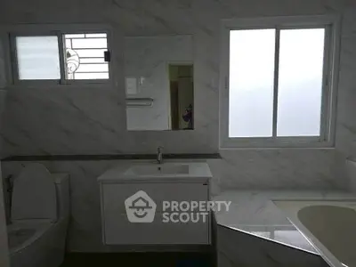 Elegant bathroom with modern fixtures and marble accents