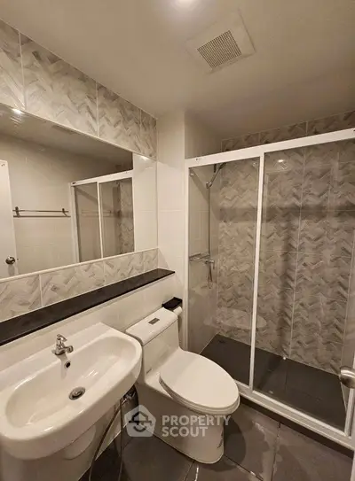 Modern bathroom with sleek shower and stylish tiles