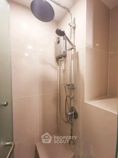 Modern bathroom shower with sleek design and built-in seating area
