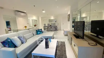 Spacious modern living room with elegant decor and open layout in luxury apartment.