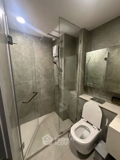 Modern bathroom with glass shower and sleek design