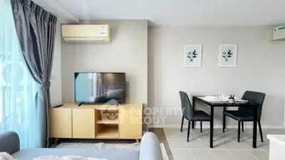 Modern living room with sleek furniture and natural light, perfect for urban living.