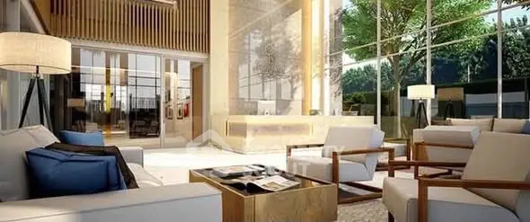 Luxurious modern living room with floor-to-ceiling windows and elegant furnishings.