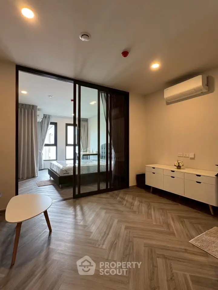 Modern living room with glass partition and stylish flooring