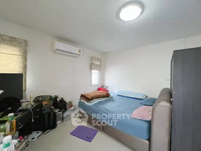 Cozy bedroom with modern air conditioning and ample storage space