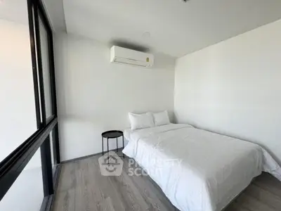 Modern minimalist bedroom with large window and air conditioning