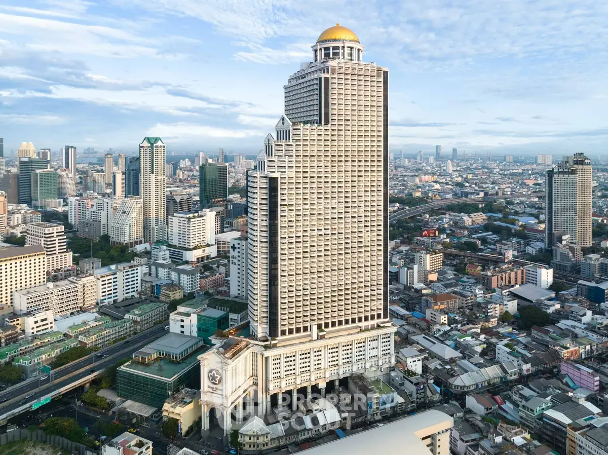 Stunning aerial view of a modern high-rise building in a bustling cityscape.