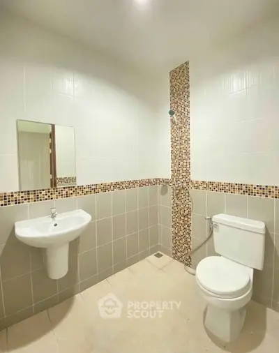 Modern bathroom with sleek fixtures and stylish tile accents