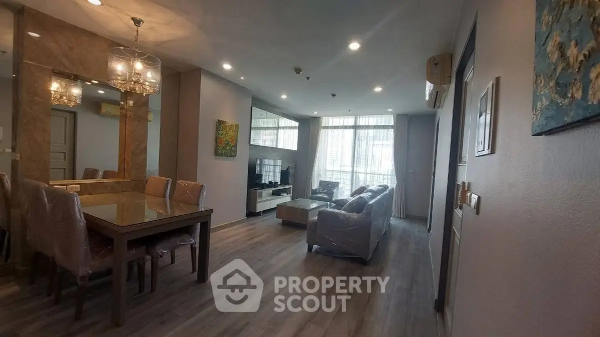 Spacious living room with elegant dining area and modern decor