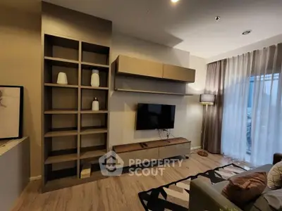 Modern living room with stylish shelving and wall-mounted TV, featuring floor-to-ceiling curtains and cozy lighting.