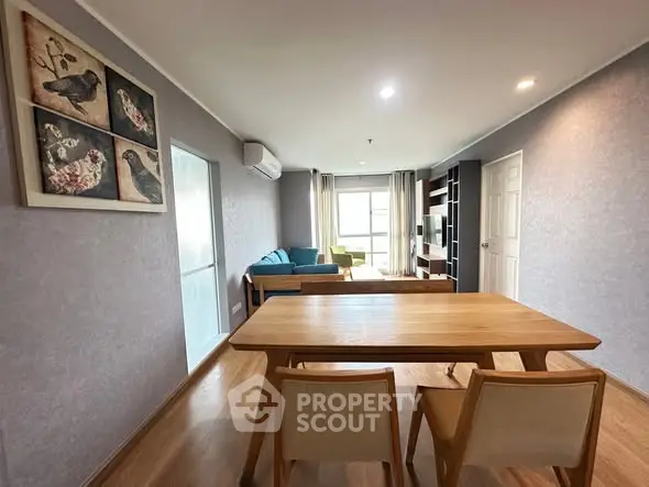 Spacious living room with modern decor and wooden furniture