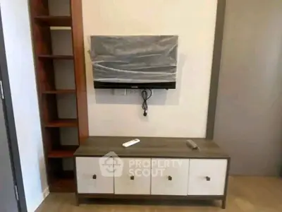Modern living room with stylish TV stand and shelving unit, perfect for contemporary homes.