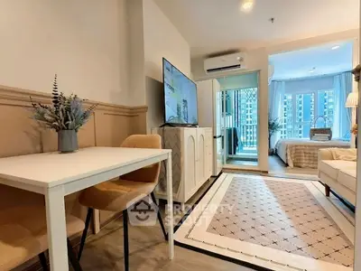 Modern apartment interior with stylish living room and cozy bedroom view.