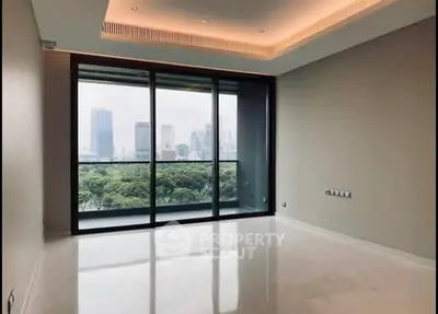 Spacious modern living room with large windows and city view