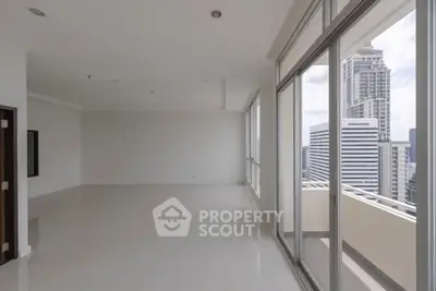 Spacious modern apartment with floor-to-ceiling windows and stunning city view