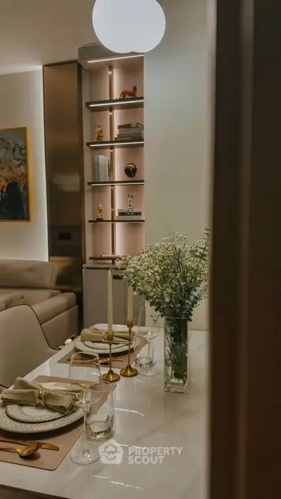 Elegant dining area with modern decor and ambient lighting in a stylish apartment.