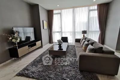 Luxurious modern living room with large windows and stylish decor