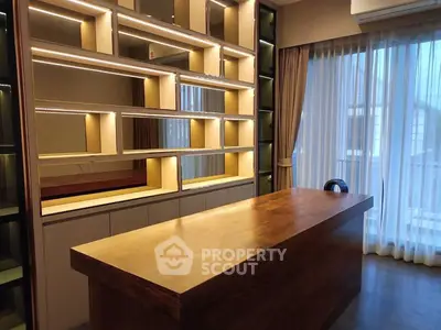 Modern study room with built-in shelves and large window with curtains