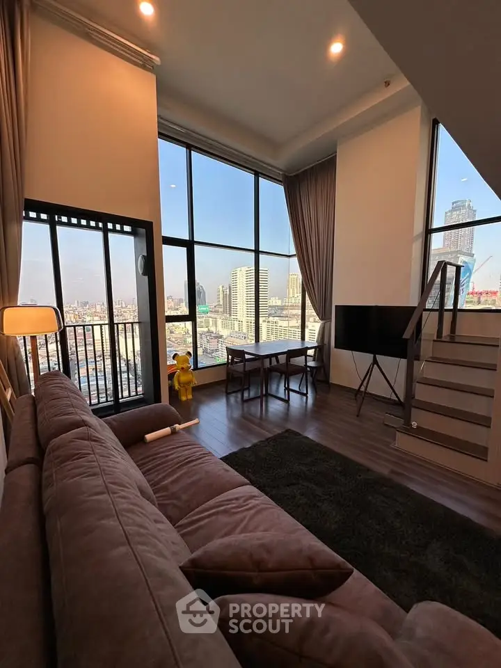 Stunning high-rise living room with floor-to-ceiling windows and city view