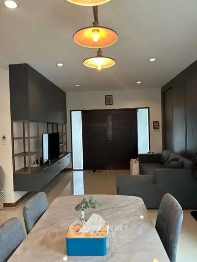 Modern living room with stylish furniture and open layout, perfect for family gatherings.