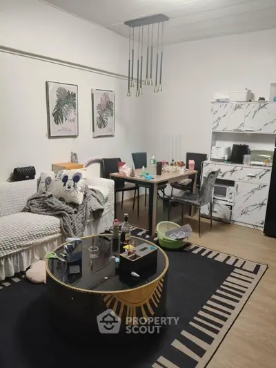 Chic living room with modern decor and stylish furniture, perfect for urban living.