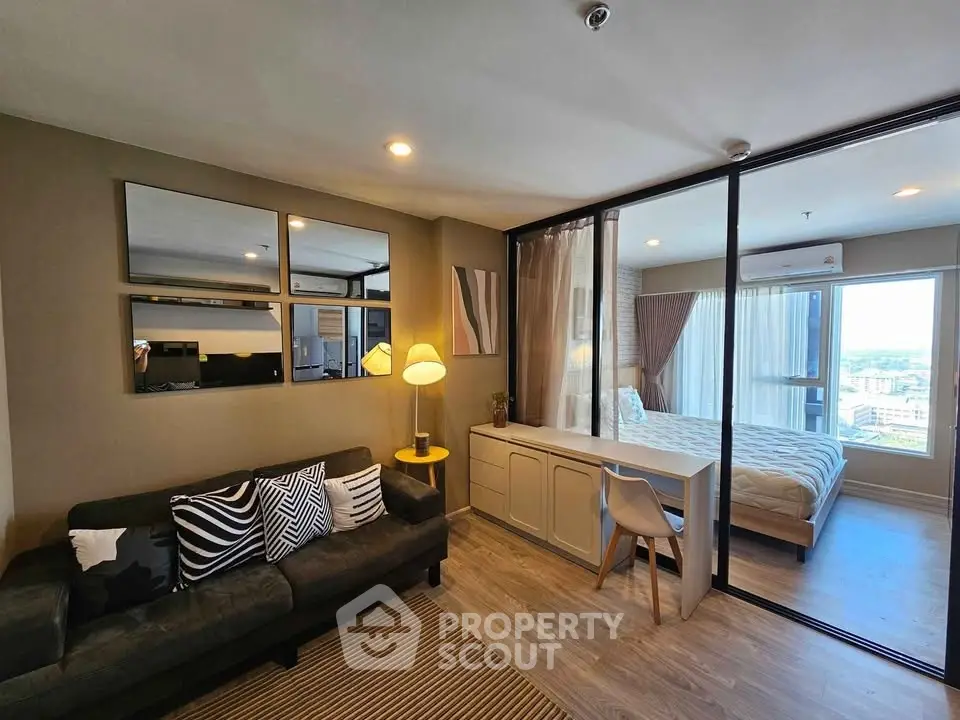 Modern living room with cozy sofa and stylish bedroom view