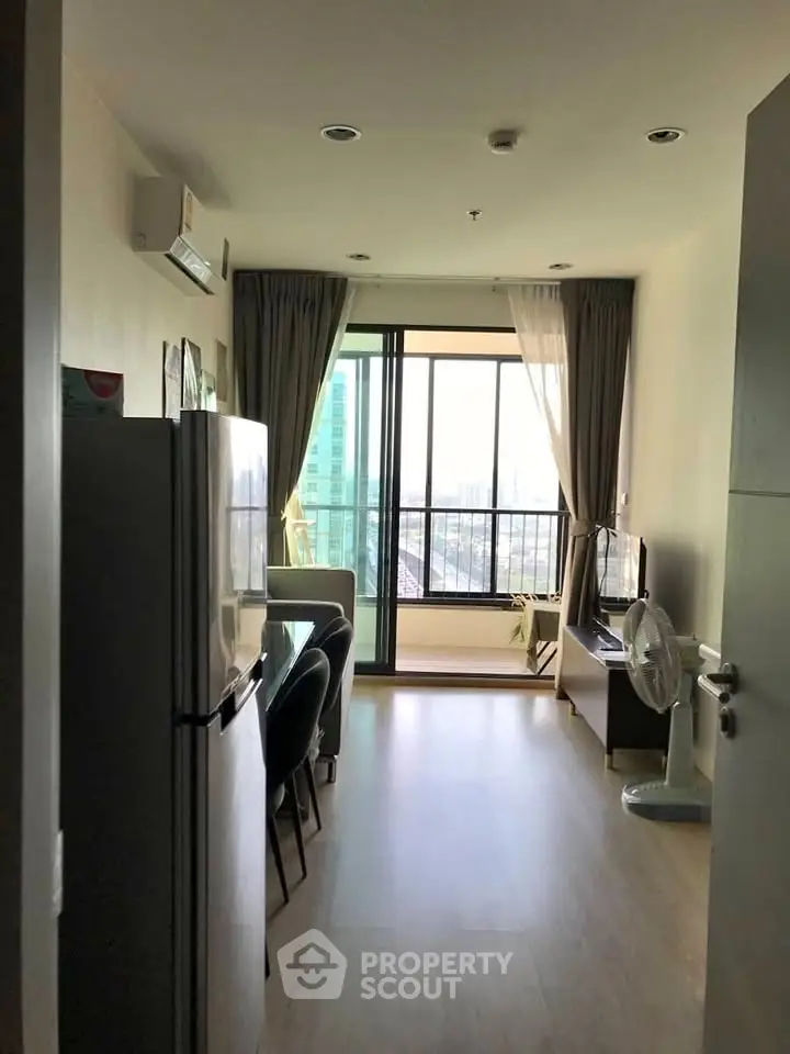 Modern apartment interior with balcony view and sleek furnishings