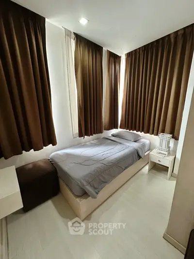 Cozy bedroom with natural light and modern furnishings