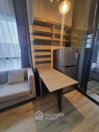 Modern living room with stylish shelving and compact dining table