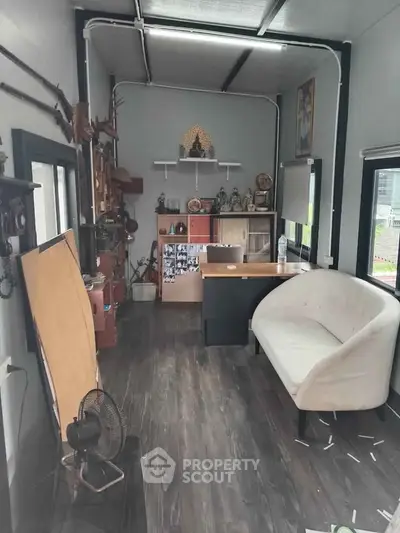 Cozy office space with modern decor and wooden flooring