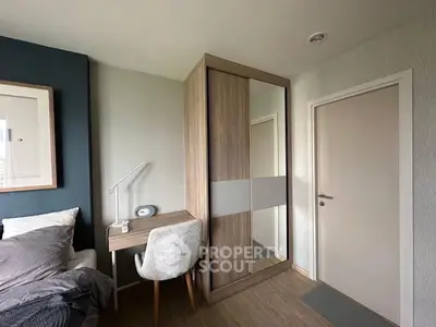 Modern bedroom with stylish wardrobe and cozy workspace