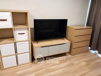 Modern living room with stylish wooden furniture and flat-screen TV