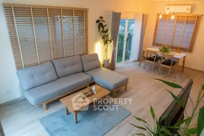 Modern living room with stylish furniture and natural light, perfect for relaxation and entertaining.