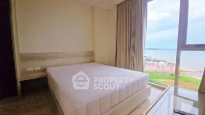 Cozy bedroom with stunning ocean view and large window