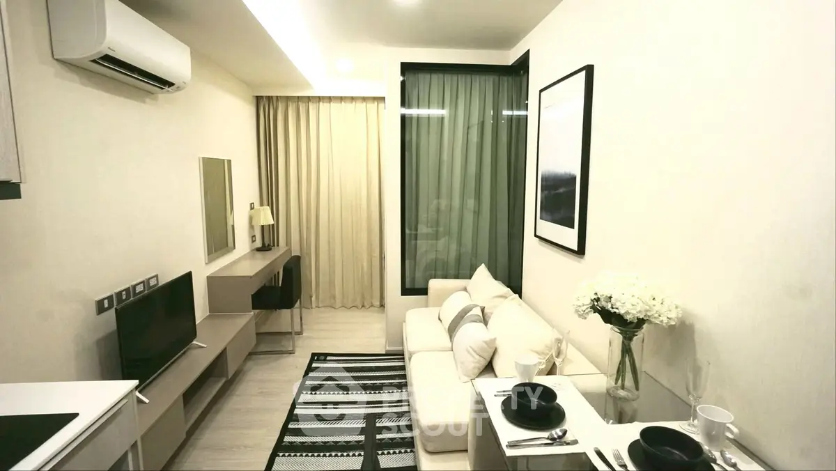Modern living room with sleek furniture and stylish decor in a cozy apartment setting.