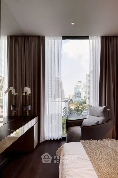 Luxurious bedroom with city view, modern decor, and floor-to-ceiling windows in a high-rise apartment.