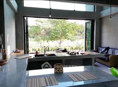 Spacious modern kitchen with open layout and stunning garden view
