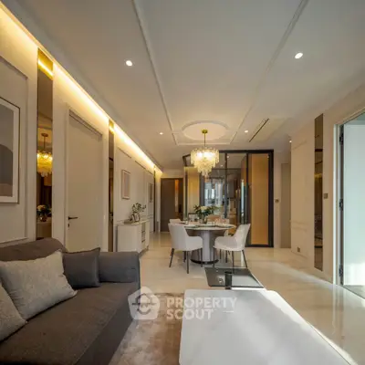 Luxurious living room with elegant dining area and modern lighting in a sophisticated apartment.